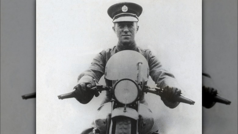 Lawrence sitting on motorcycle