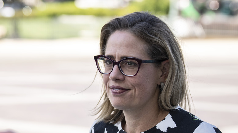 Senator Kyrsten Sinema smiling