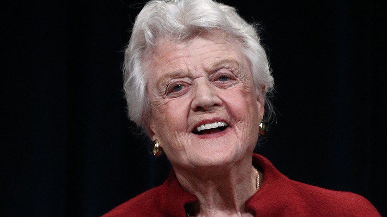 Angela Lansbury laughing black background