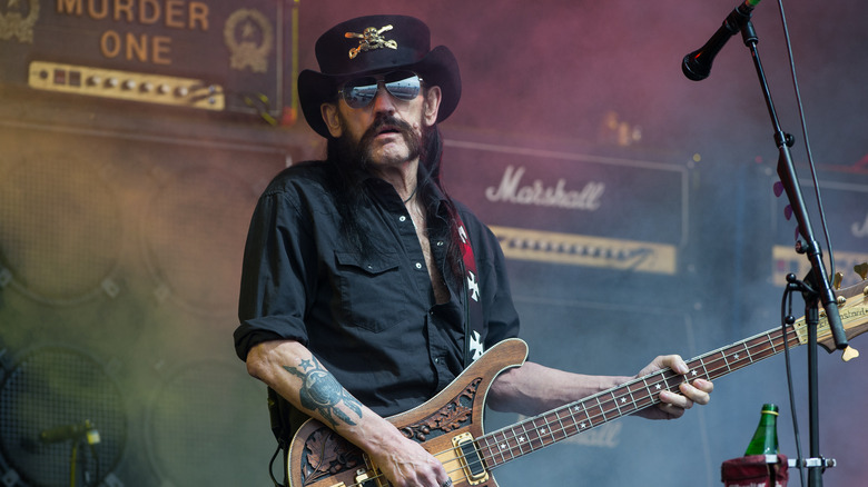 Lemmy Kilmister hat sunglasses guitar on stage