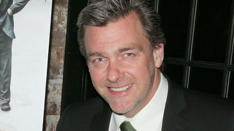 Ray Stevenson smiling suit