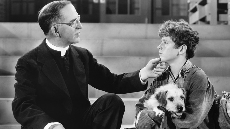 Father Edward Flanagan consoling a child