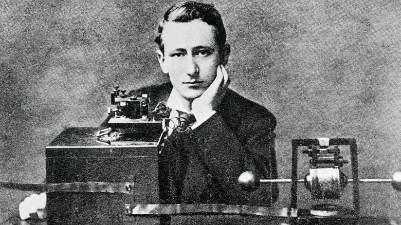 Marconi sitting with typewriter