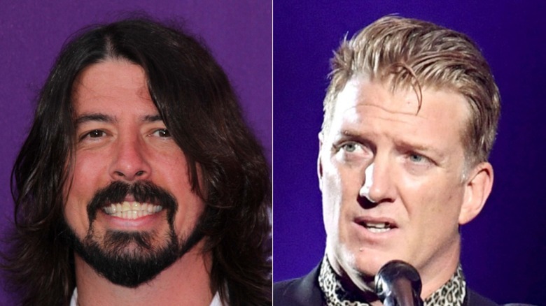 Dave Grohl smling and Josh Homme looking confused