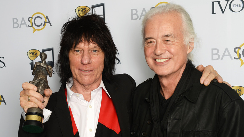 Jeff Beck and Jimmy arms around each other