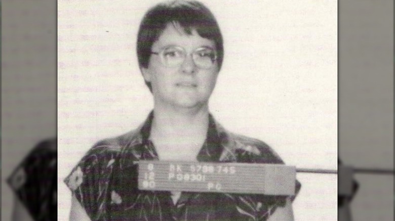 carol m. bundy wearing glasses with her mouth slightly open in her mugshot