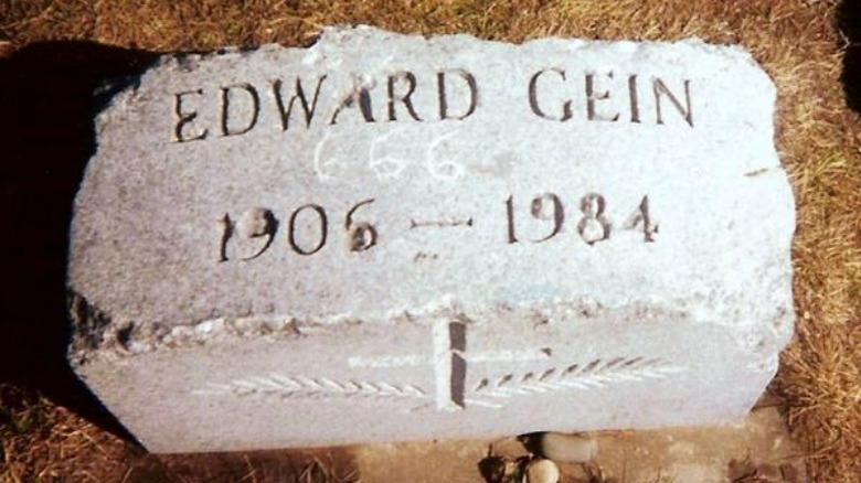 ed gein's gravestone with a 666 carved into