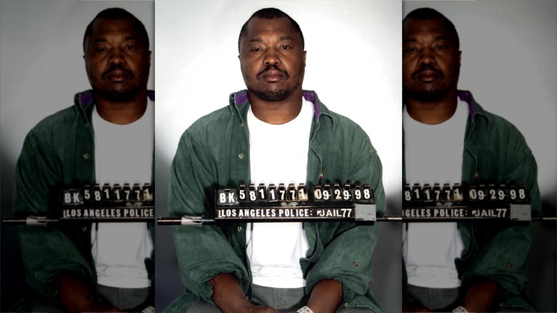 Lonnie David Franklin Jr. wearing a green jacket and looking unhappy in his mugshot