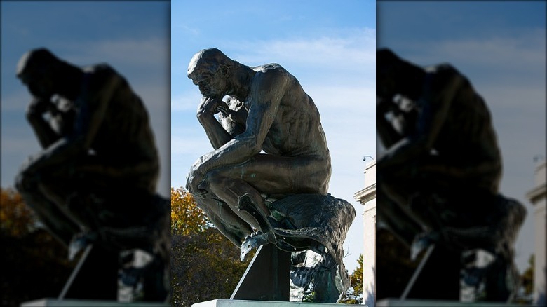 The Thinker by Rodin with damaged legs