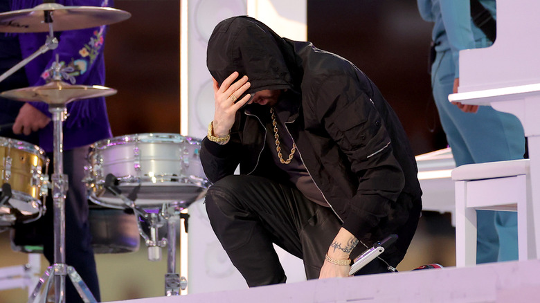 Eminem kneeling