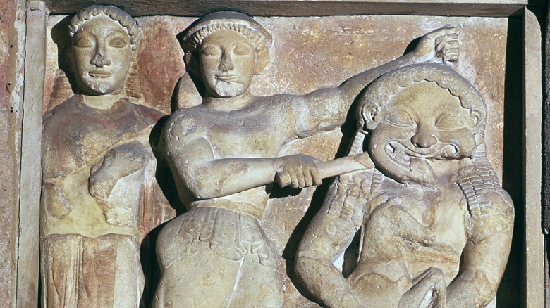 carving of athena helping Perseus kill medusa
