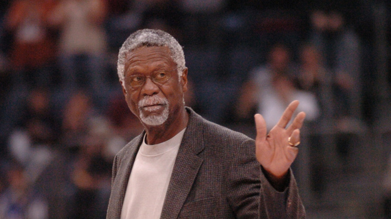 Bill Russell waves to a crowd