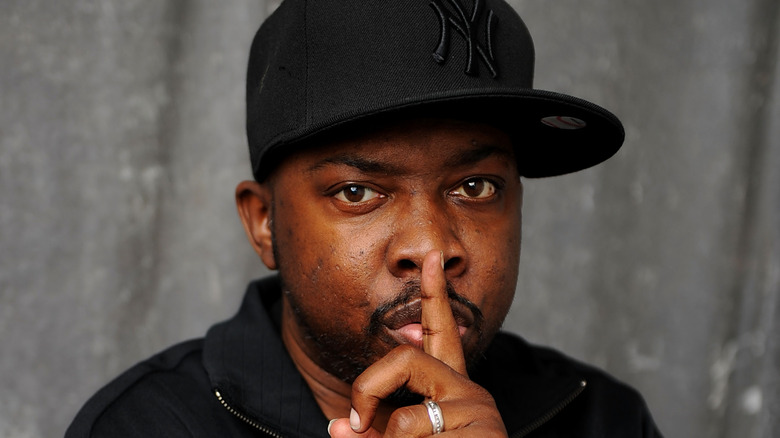 Phife Dawg finger in front of nose