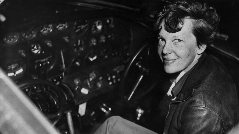 Amelia Earhart in an airplane cockpit 