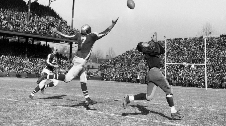 Steagles player jumping for football