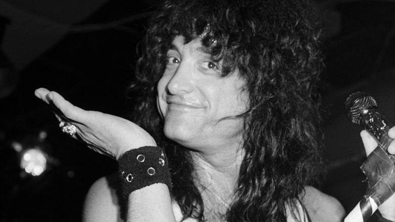 Kevin DuBrow posing with microphone