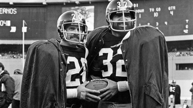 Rocky Bleiler and Franco Harris in uniform