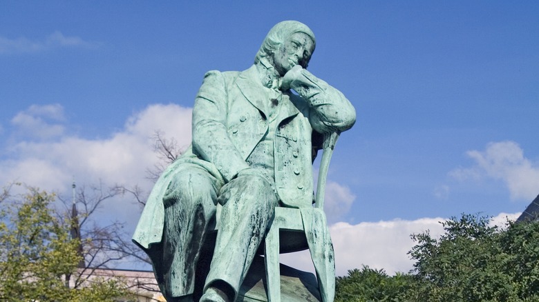 Robert Schumann green weathered statue blue sky