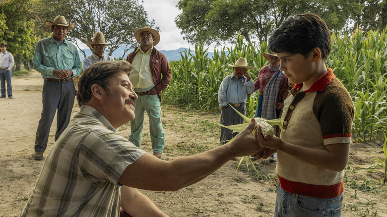 Jose's father shows him corn