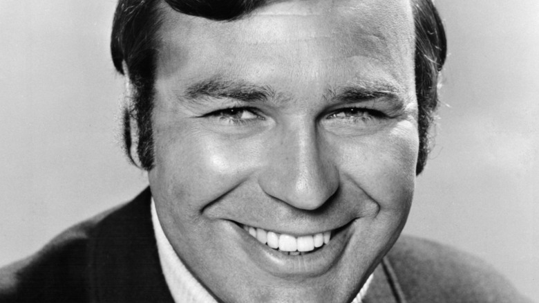 Jim Lange smiling in black and white publicity photo