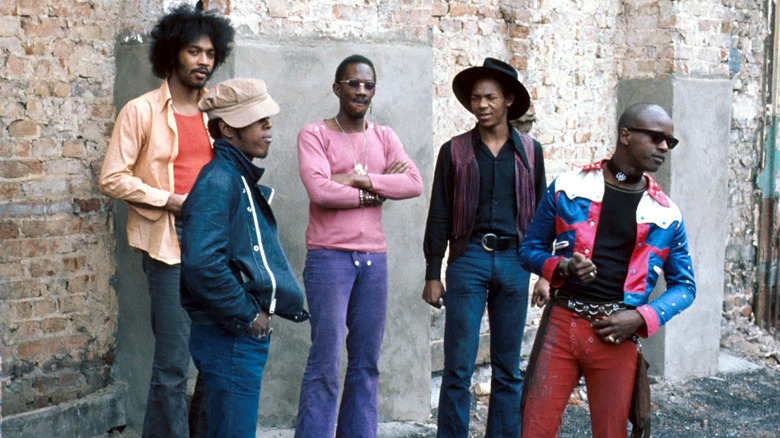 Parliament-Funkadelic in front of brick wall