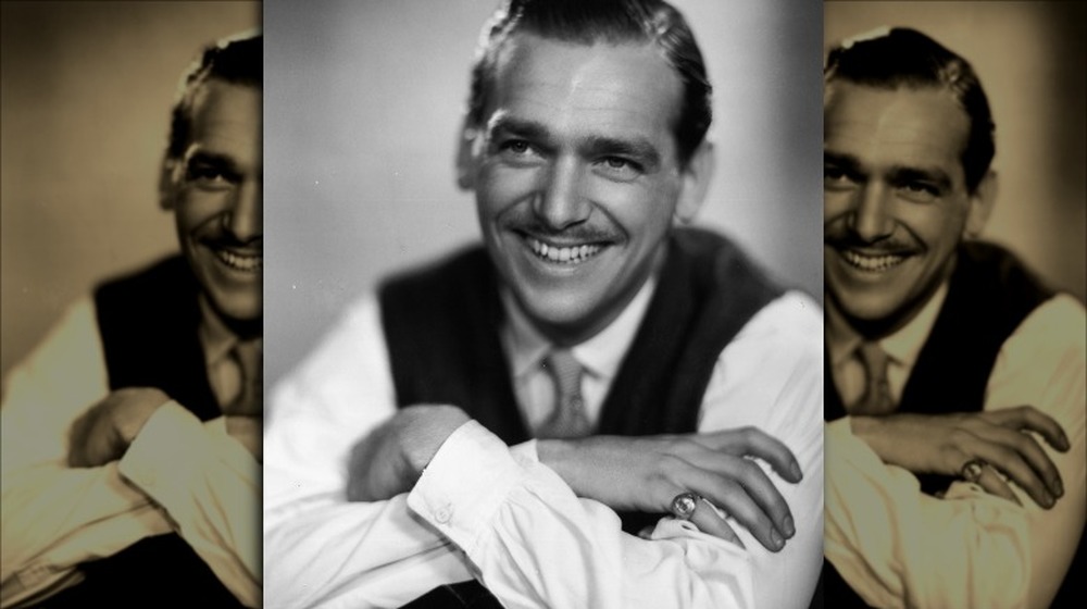 douglas fairbanks with arms crossed