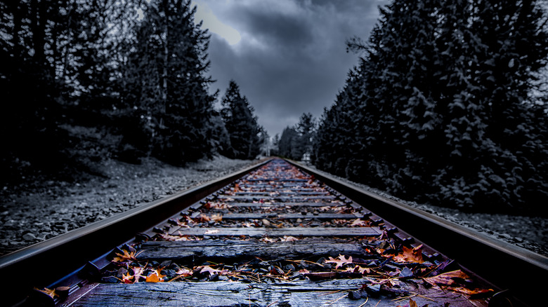Dark abandoned railroad tracks