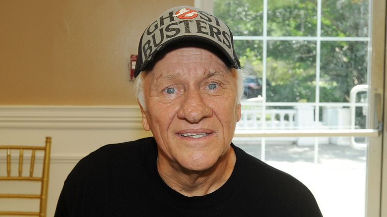 George Wilbur smiling wearing Ghostbusters cap 