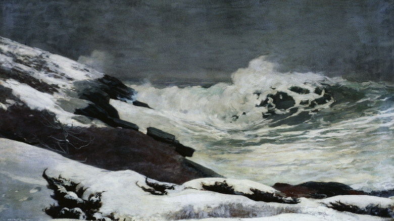 Waves hit a snowy beach