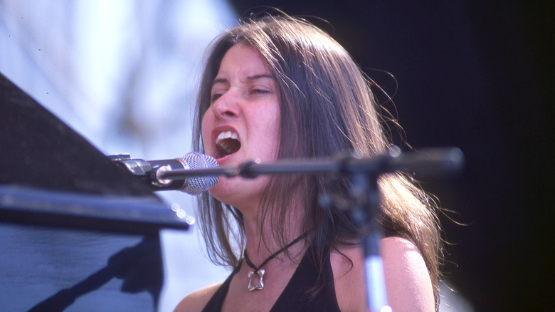 Paula Cole singing at piano