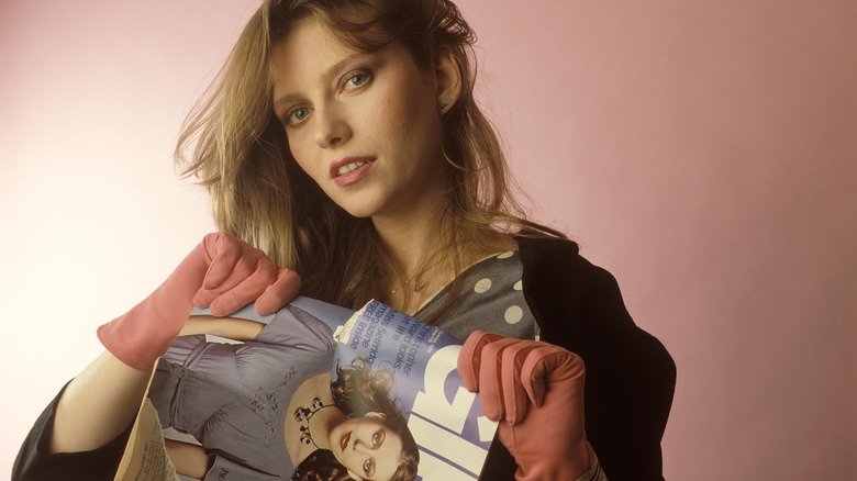 Bebe Buell tearing up a magazine