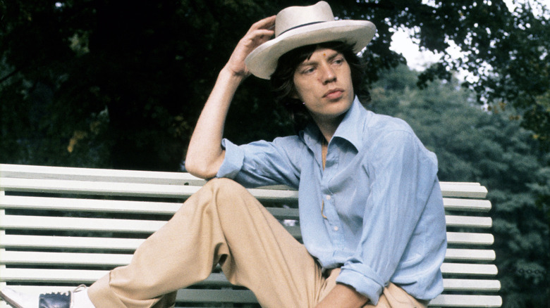 Mick Jagger sitting outside