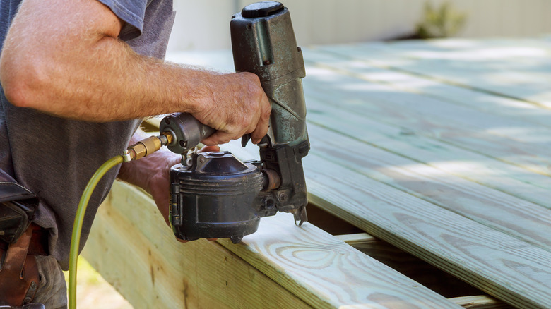 Man using nail gun