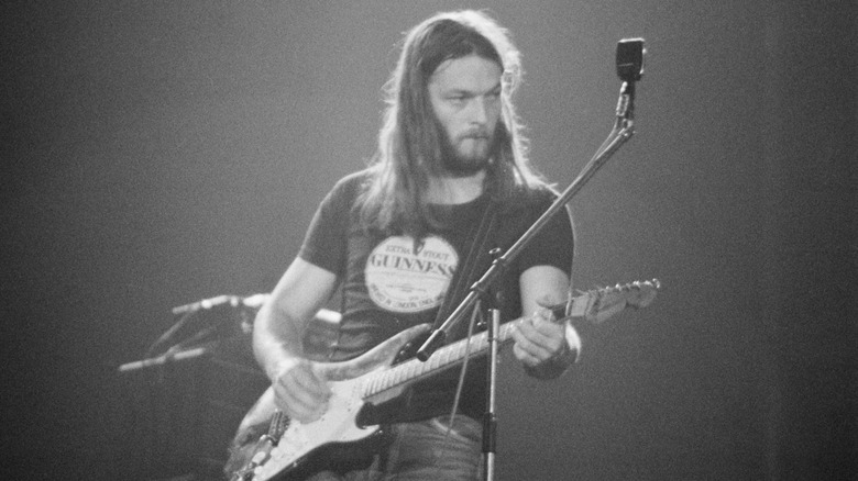 David Gilmour playing guitar onstage