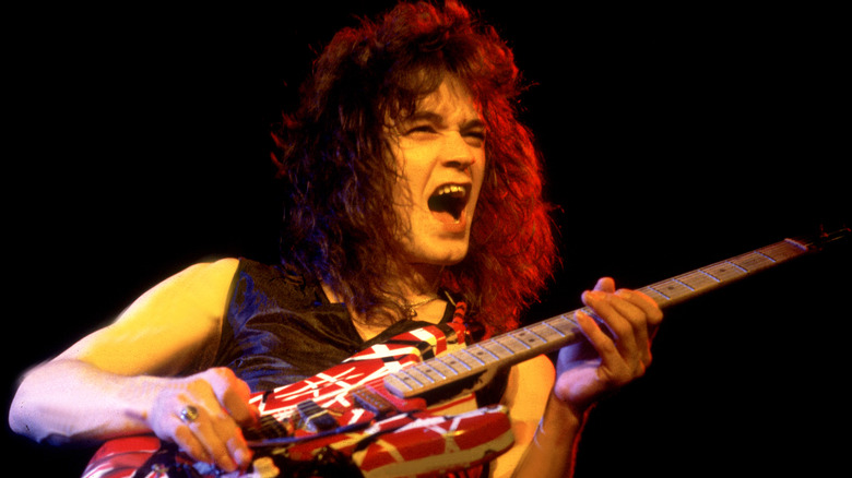 Eddie Van Halen playing guitar onstage