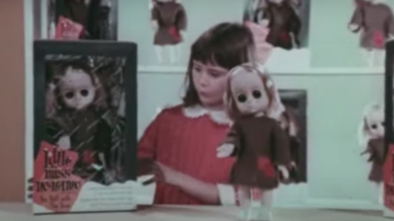 Girl with Little Miss No Name Doll