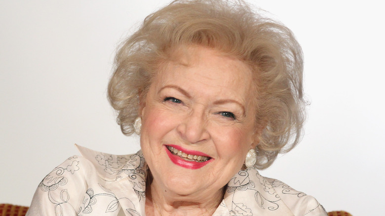 Betty White smiling white background