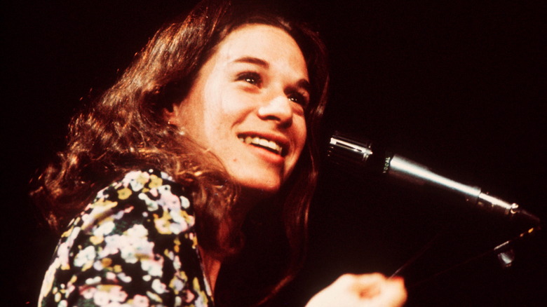Carole King smiling at piano 1972
