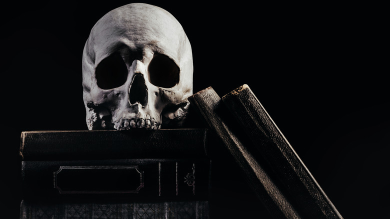 Skull on top of antique books 