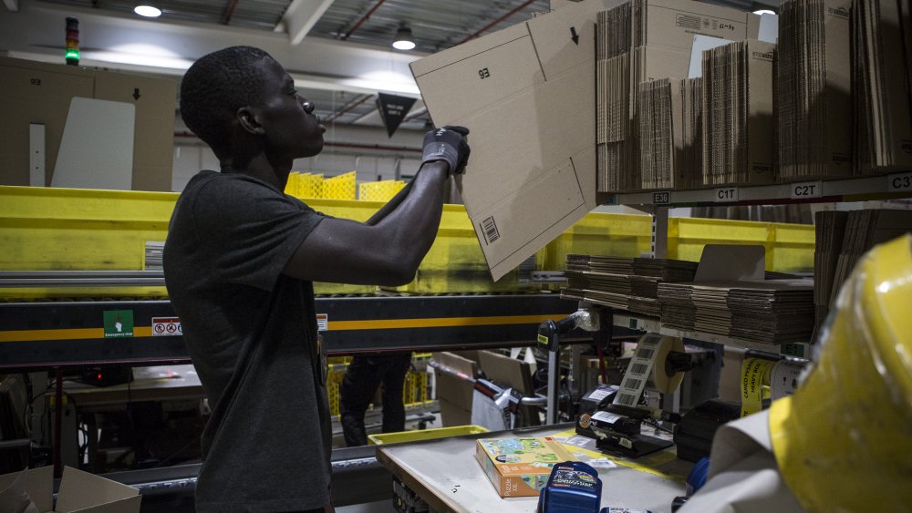 Amazon warehouse associate working on Black Friday