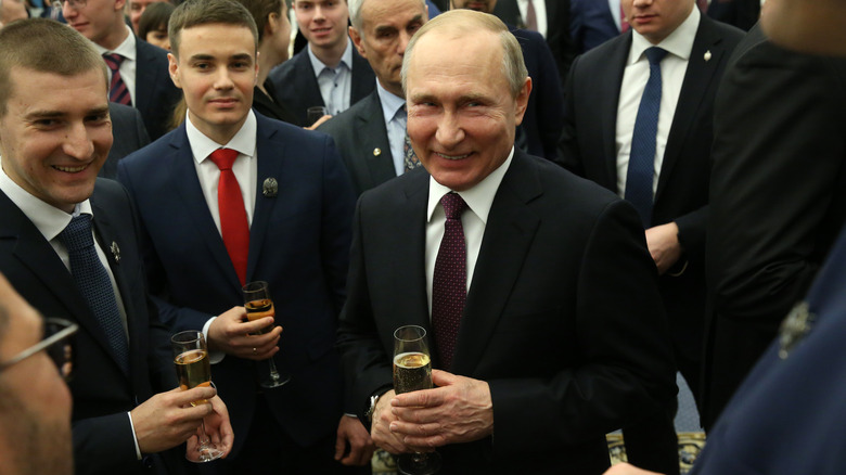 putin laughing at a party