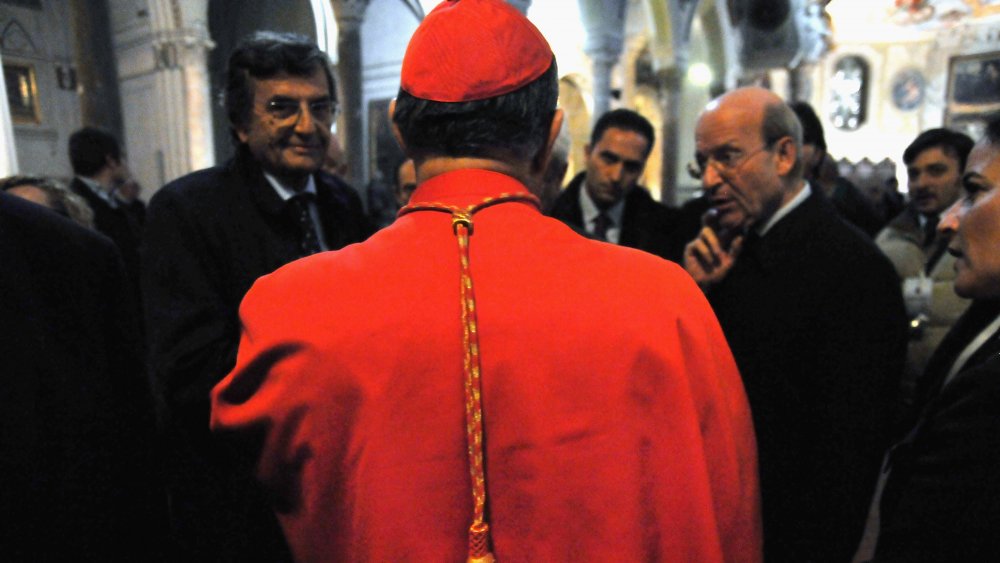 The Cardinal Crescenzio Sepe speaks with civil authorities after the ceremony on the day of the blood miracle at Naples Cathedral. 