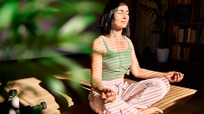A woman practicing meditation