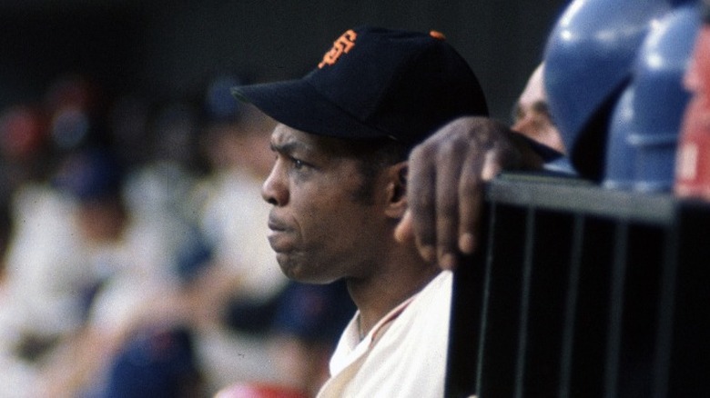 Willie Mays watching from dugout