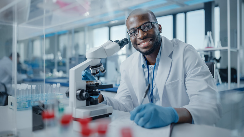 scientist with microscope