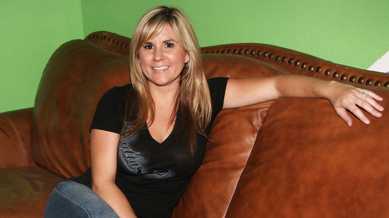 Brandi Passante poses on a couch