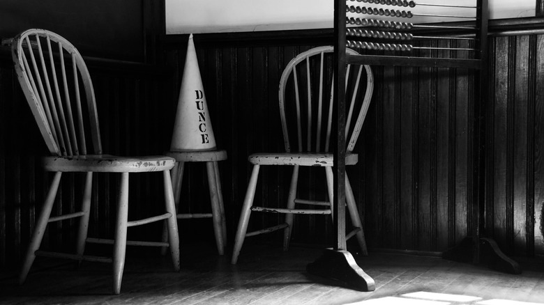 A dunce cap in classroom