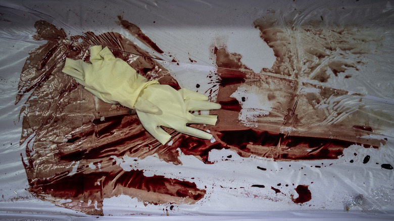 blood and a glove on plastic