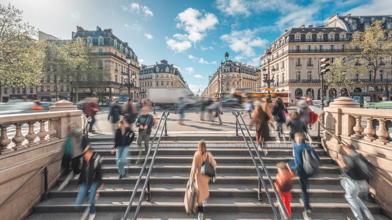 Passersby entering Paris metro