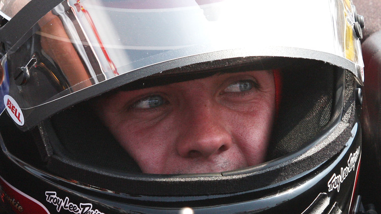 Close up of Frankie Muniz wearing his racing helmet